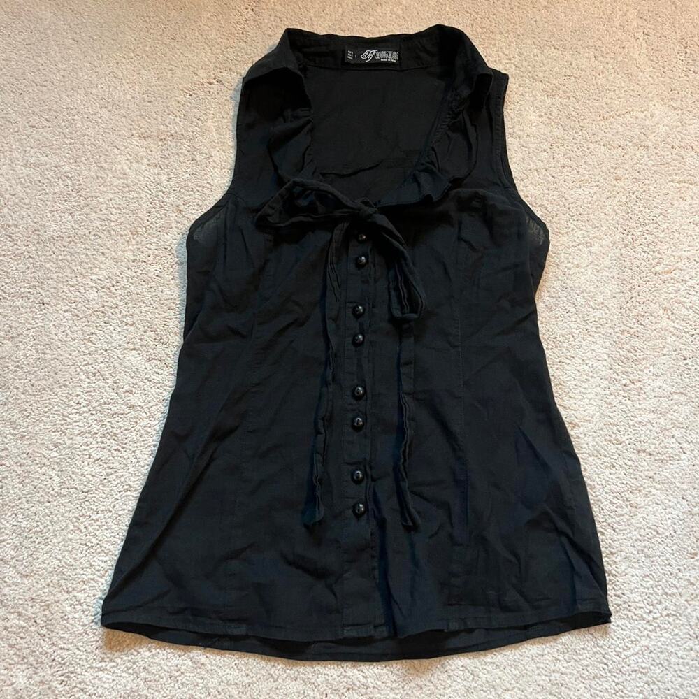 Black button up sleeveless blouse with ruffle collar and tie detail
